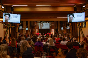 Event in P&G church, Edinburgh. Around 100 people at the event, looking towards the stage with screens.
